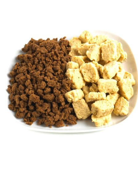 A white plate holds two types of textured soya protein, a popular meat substitute: one side has small, dark brown soya granules, and the other has larger, light beige soya chunks. Both are neatly separated and set against a plain white background.